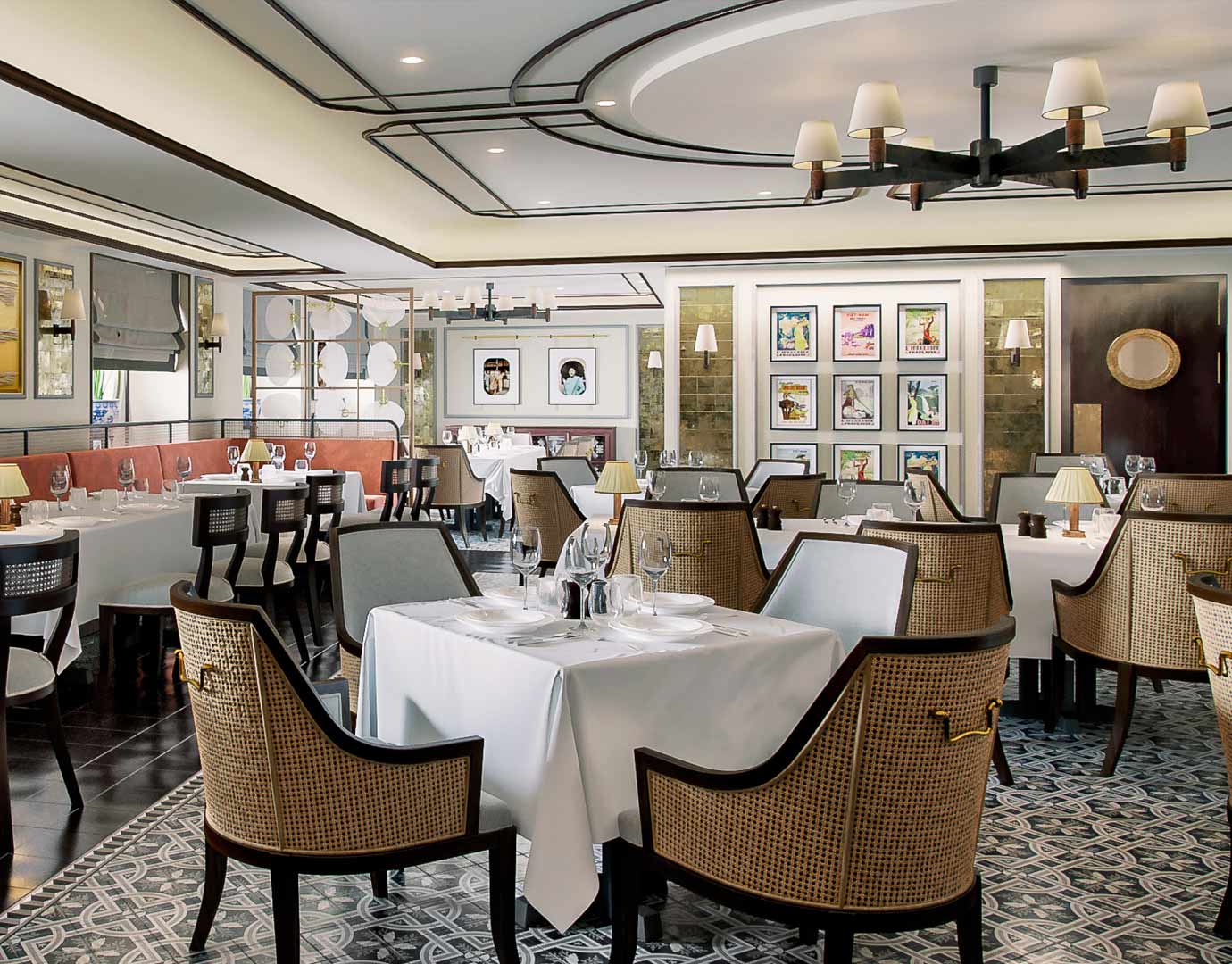 Elegant onboard restaurant with white tablecloths, stylish chairs, and decorative wall art | MSC Cruises Elegant onboard restaurant with white tablecloths, stylish chairs, and decorative wall art | MSC Cruises