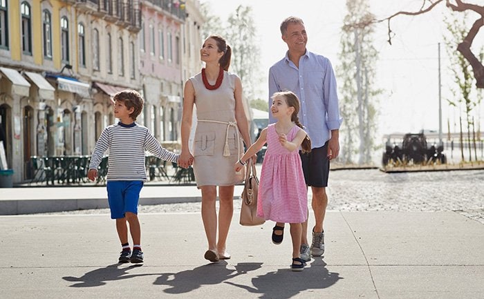 A family walking together in a charming European port town | MSC Cruises A family walking together in a charming European port town | MSC Cruises