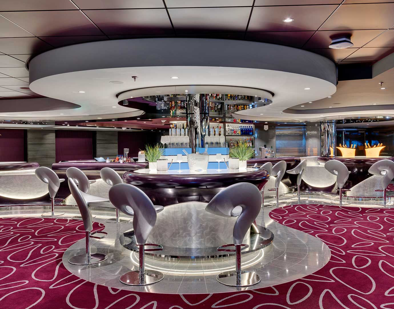 Modern bar with sleek seating and vibrant decor onboard an MSC cruise ship | MSC Cruises Modern bar with sleek seating and vibrant decor onboard an MSC cruise ship | MSC Cruises