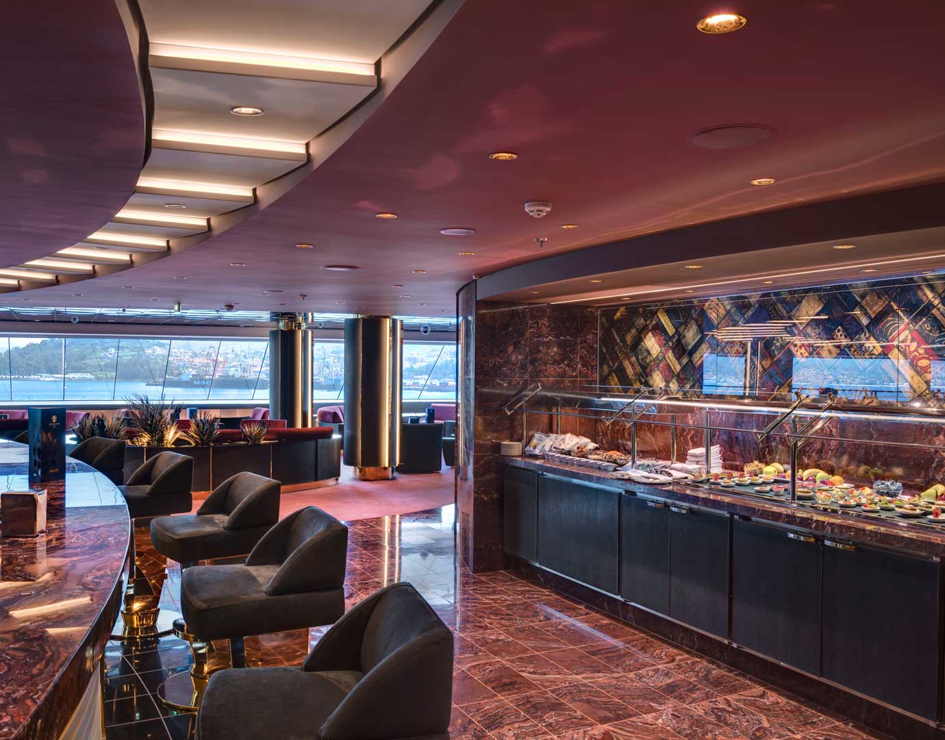 Elegant onboard buffet area with panoramic ocean views and luxurious seating | MSC Cruises Elegant onboard buffet area with panoramic ocean views and luxurious seating | MSC Cruises